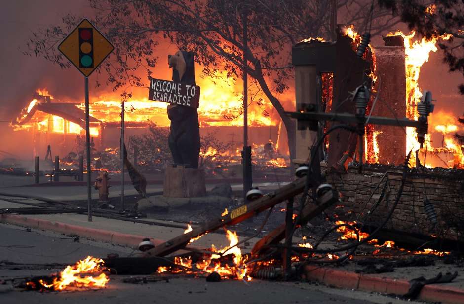 A Black Bear Diner and nearby businesses burn as the Camp Fire destroys a large portion of Paradise in Butte County, California